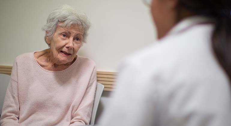 Senior patient with doctor